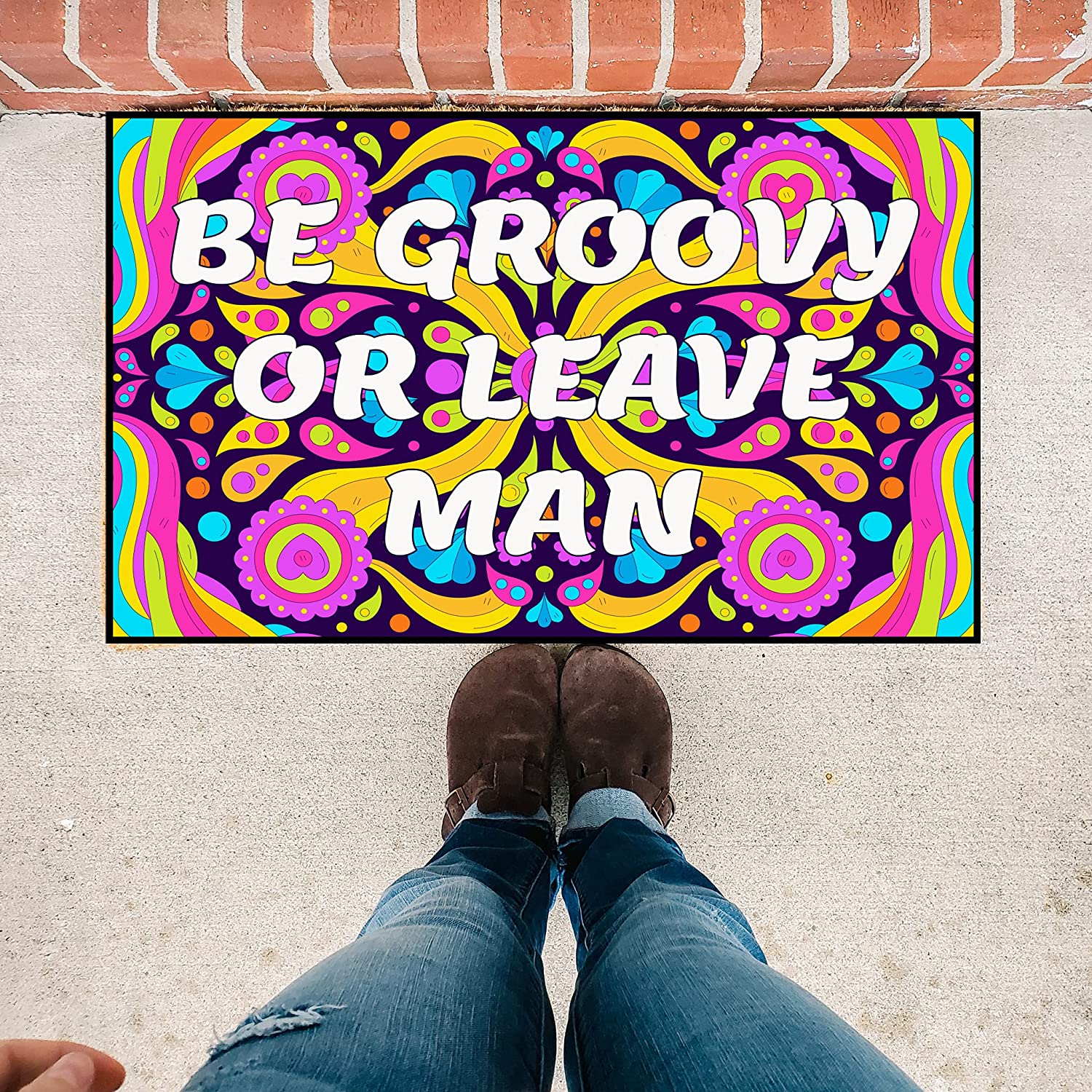 http://www.victorystore.com/cdn/shop/products/be-groovy-or-leave-man-doormat-19563-512438.jpg?v=1636133885